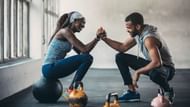 Partner workout of the day (Image via Getty Images)
